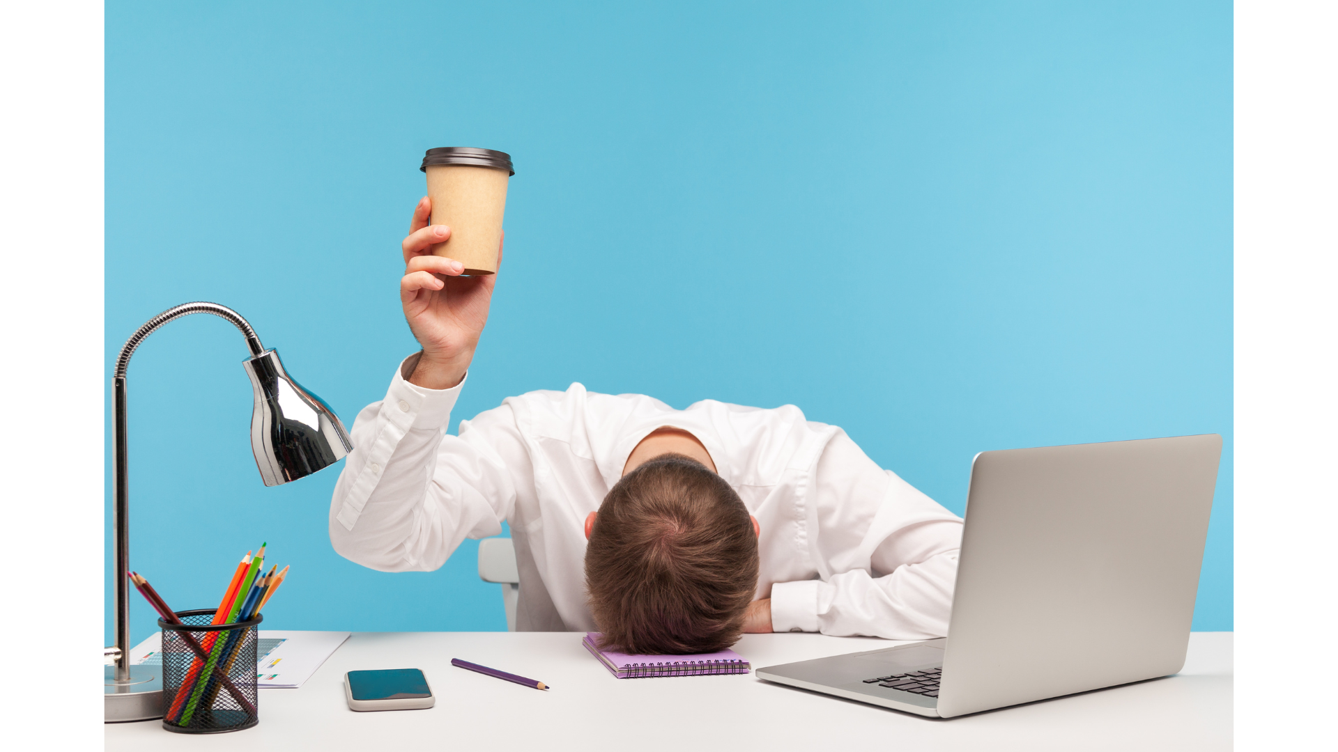 A tired team member with a coffee cup