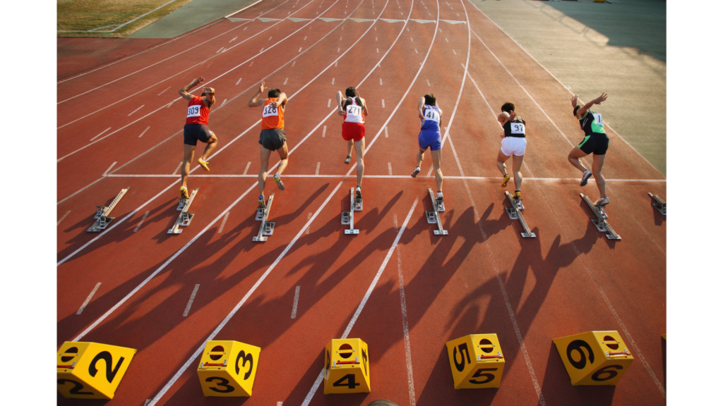 Sprinters launching out of their blocks to demonstrate a short fast race