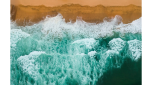 Waves crashing on a beach demonstrating a high volume
